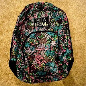 Billabong backpack in vibrant floral pattern.